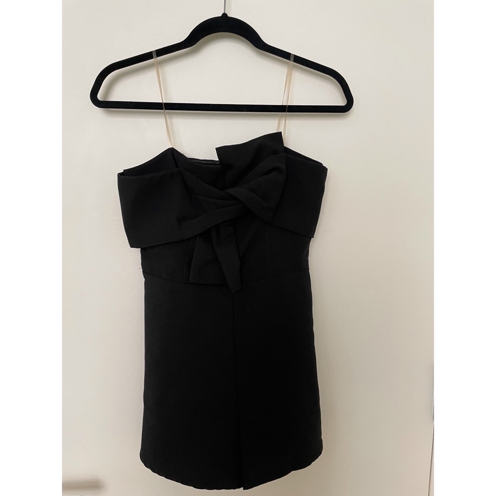 Black romper with cute assymetrical bow tie, only worn once